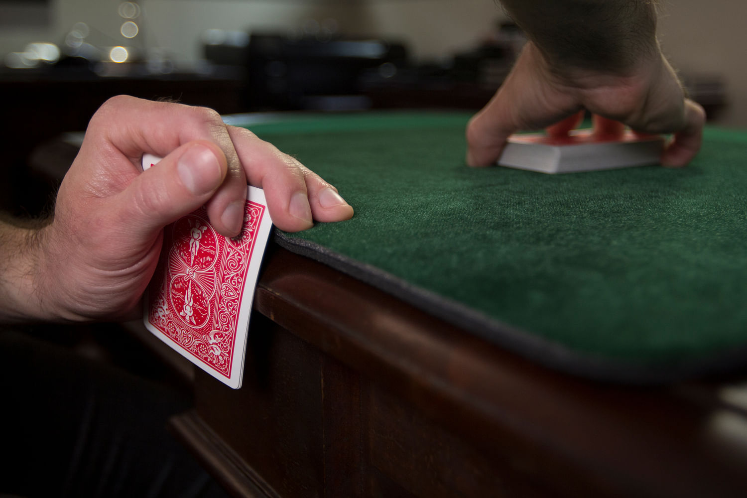 Holding out or mucking a card when cheating at a poker game