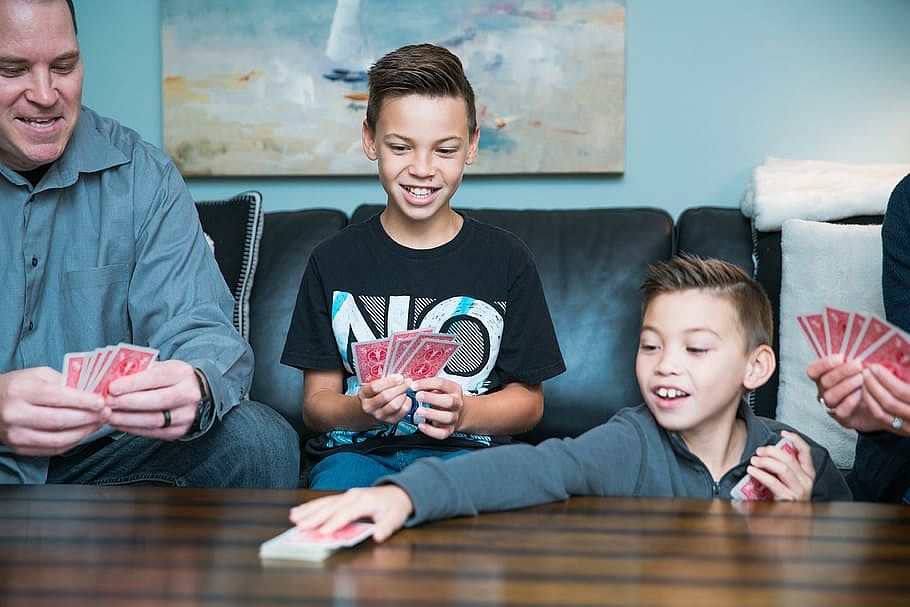 family playing cards together