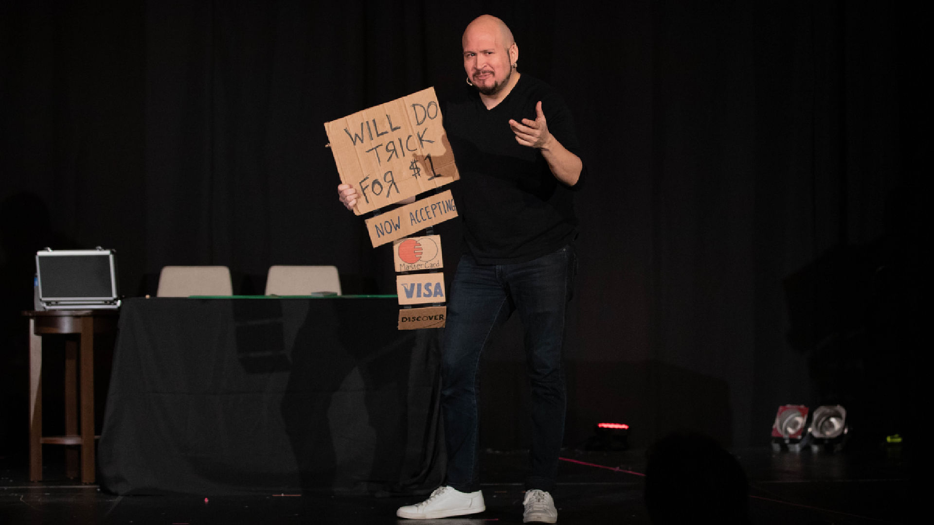 professional magician Daniel Garcia performs a funny comedy magic trick on stage at a magic convention