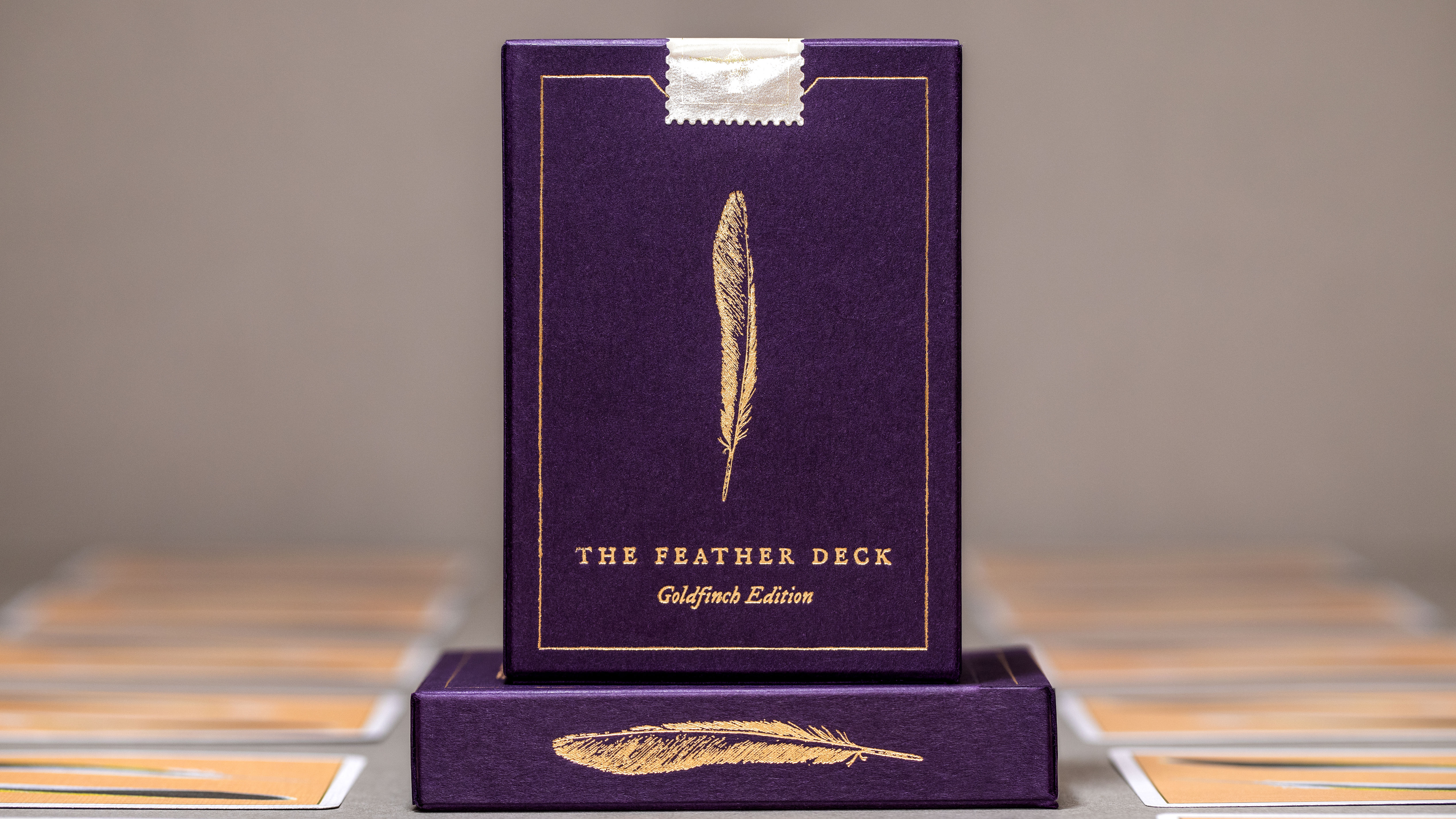 feather deck gold edition in purple tuck case with gold foiling