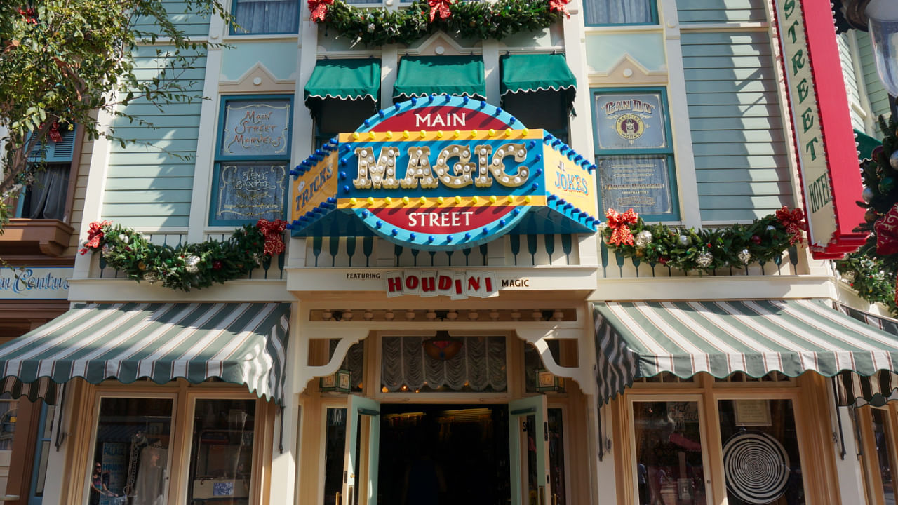front of main street magic at disneyland neon sign