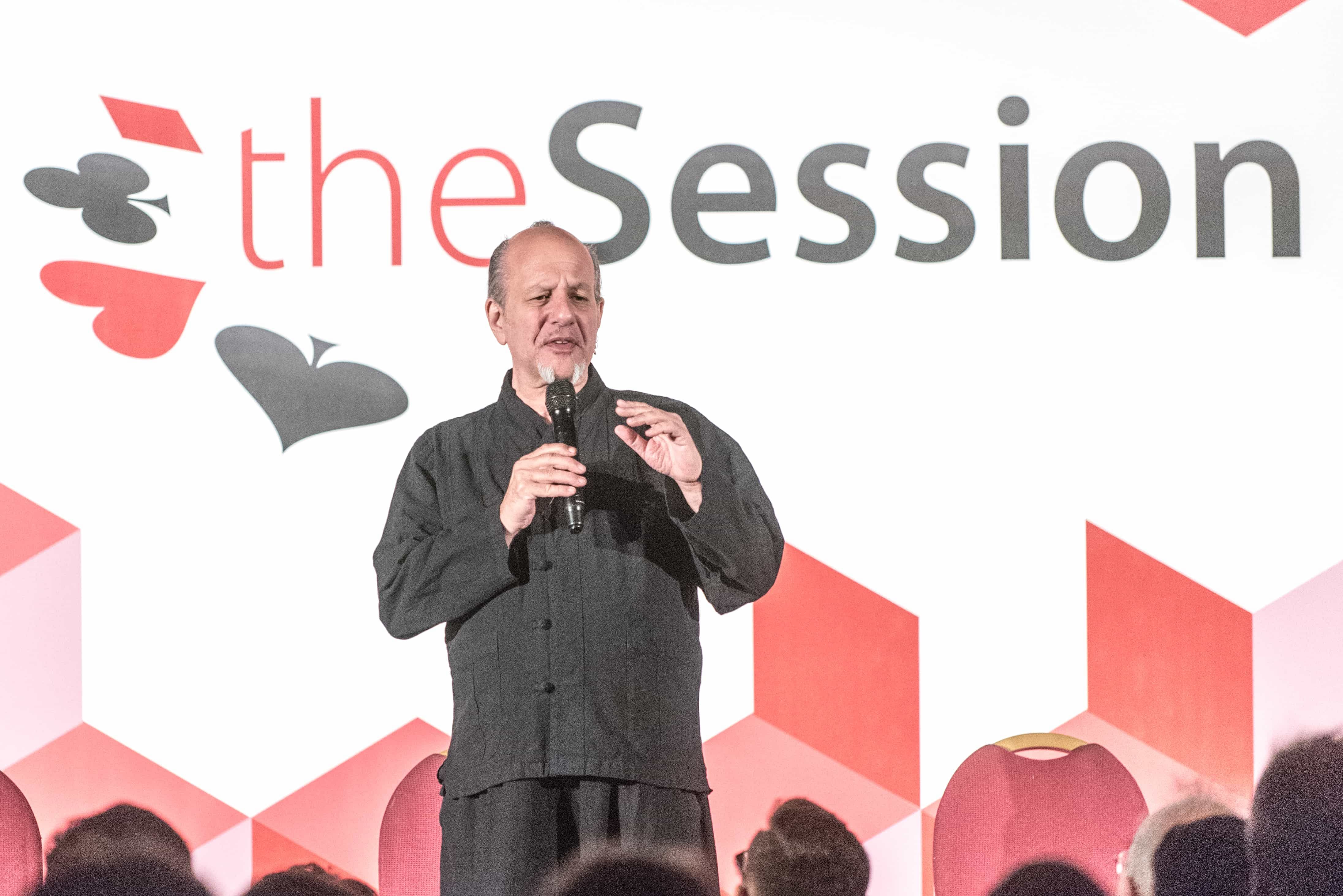 Max Maven lectures about the art of mentalism on stage at The Session