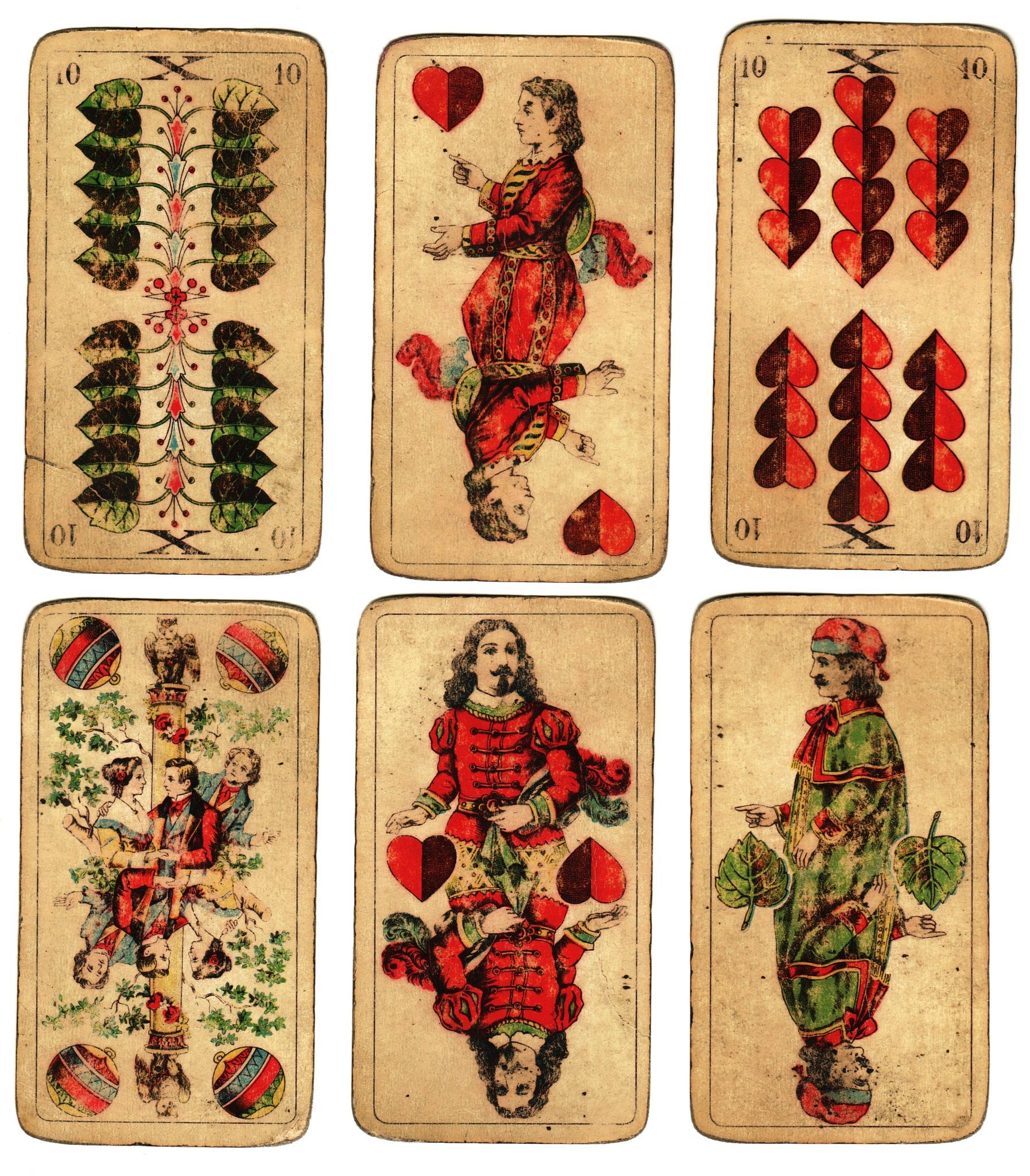 old playing cards and a antique set of court cards