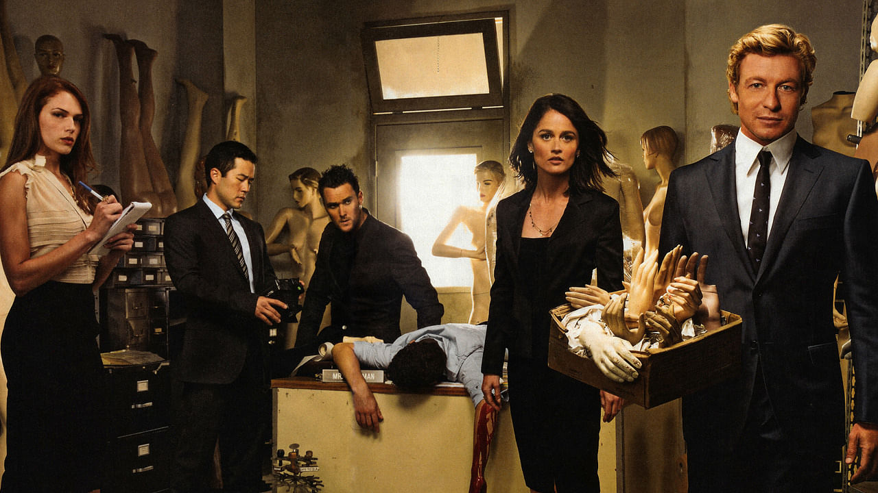 The cast of the CBS TV Show The Mentalist poses for a promotion photo led by Patrick Jane